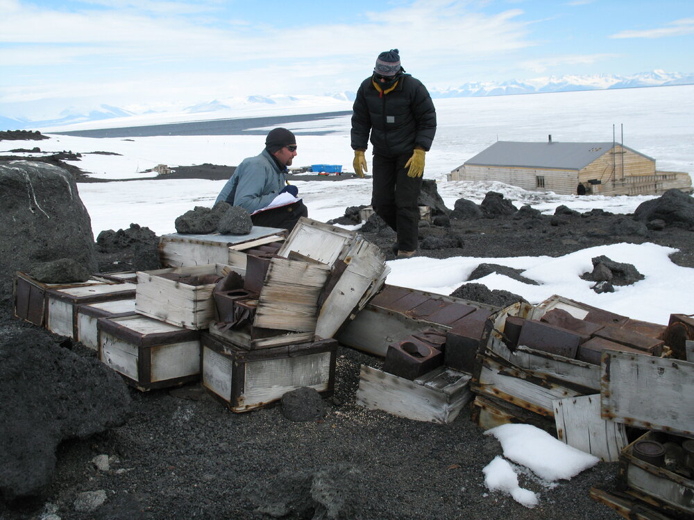 Matthew Brown and Megan Absolon inspecting Venesta cases, Cape Evans