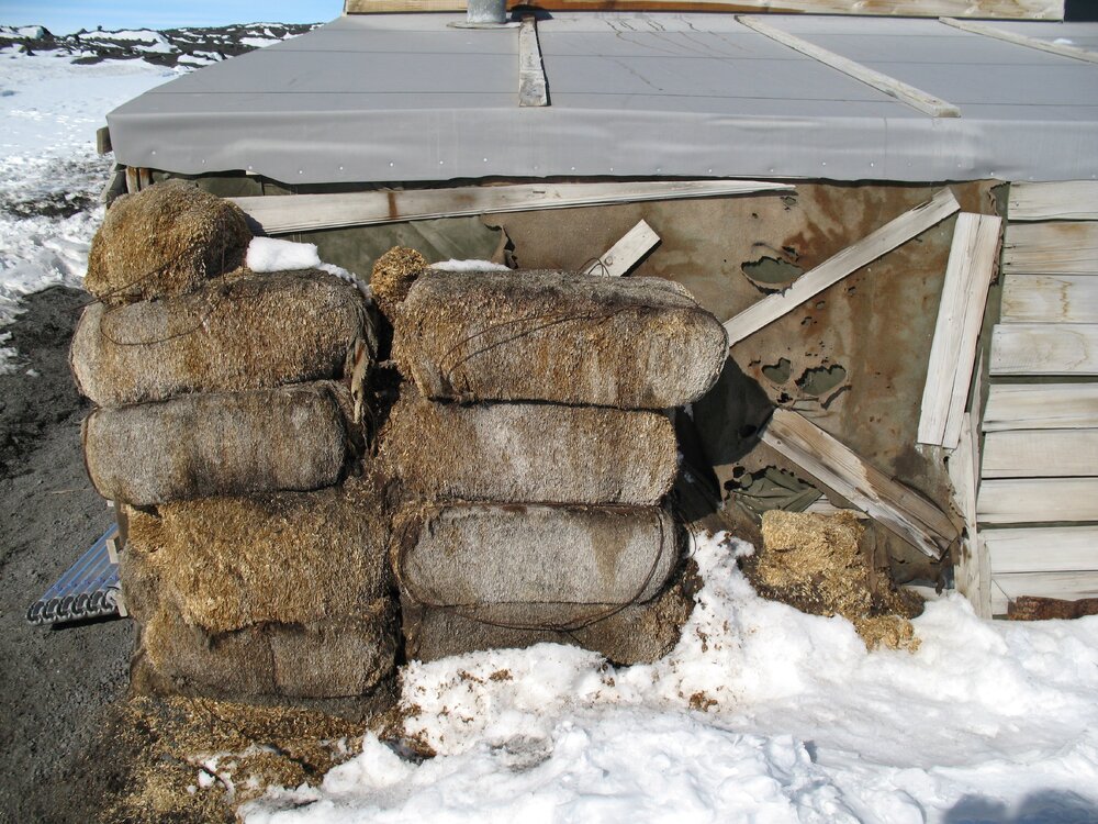 Fodder bales at North elevation, east end of stable