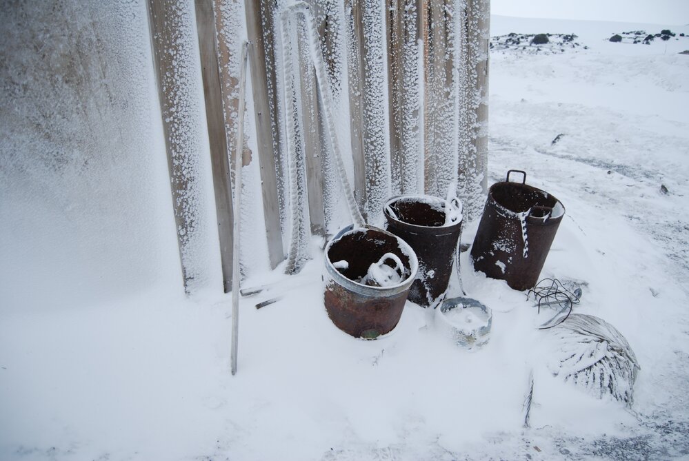 Snow build-up on artefacts outside Scott's 'Terra Nova' hut