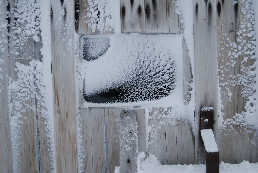 Snow build-up on wall and stables door handle, Scott's 'Terra Nova' hut