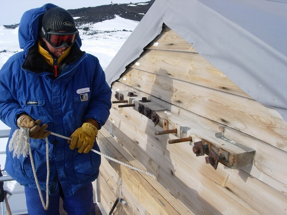 Heritage Carpenter Bryce Lewis working on east wall