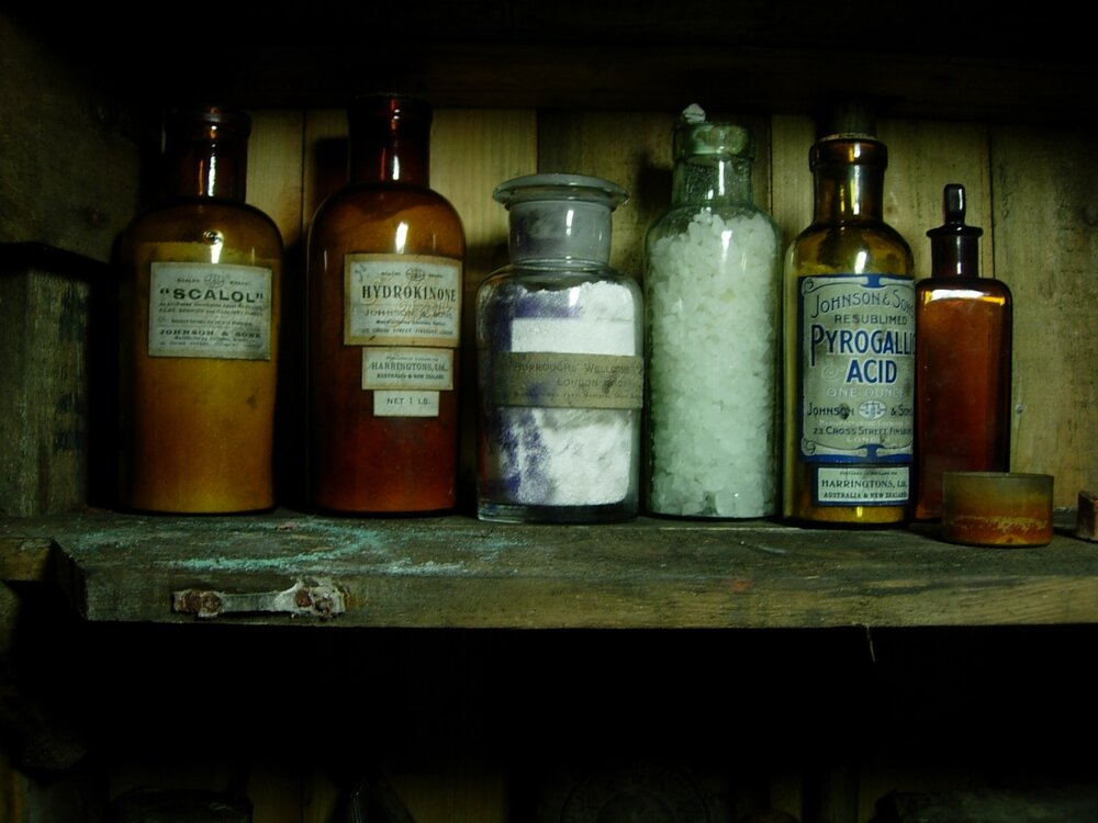 Chemical bottles on shelves in the Darkroom