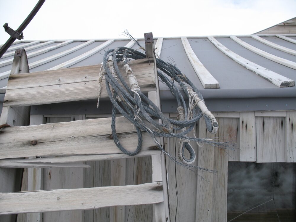 Sled and steel wire, west wall of Scott's 'Terra Nova' hut