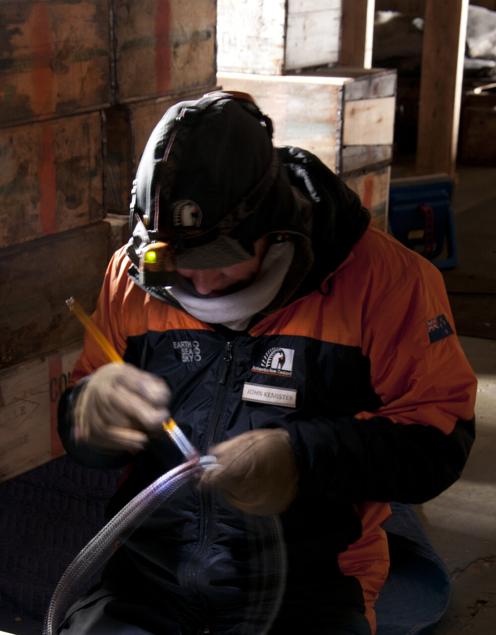 Conservator John Kemister working in Scott's 'Terra Nova' hut