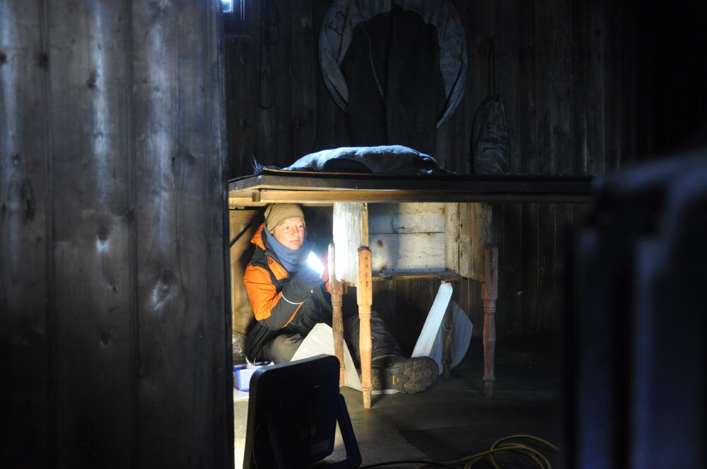 2013-14 Nicola Dunn working inside Scott's 'Terra Nova' hut, Cape Evans