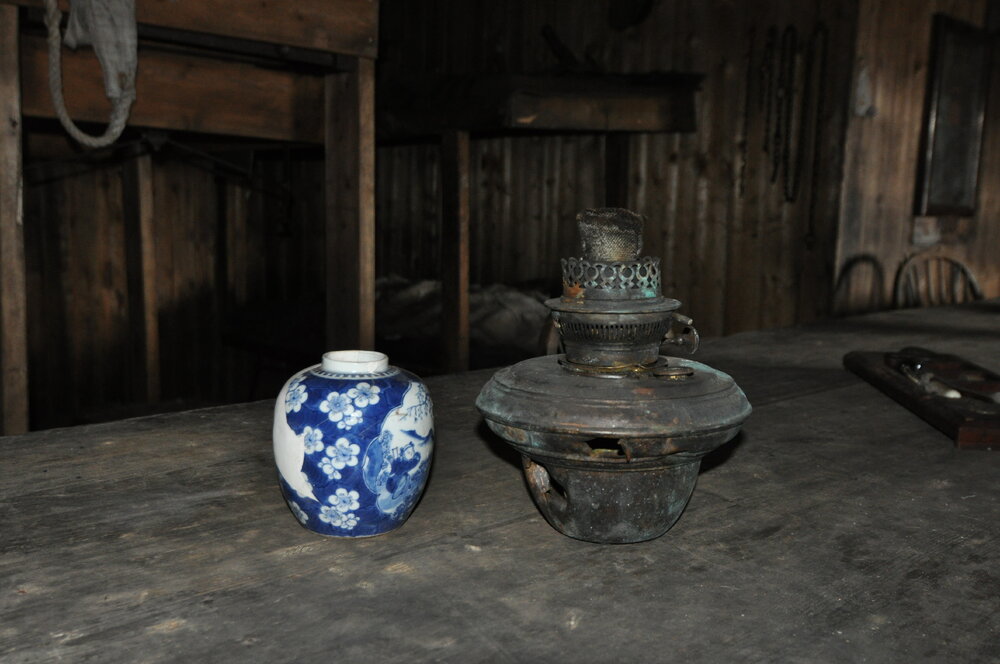 2013-14 Artefacts on the Wardroom table inside Scott's 'Terra Nova' hut