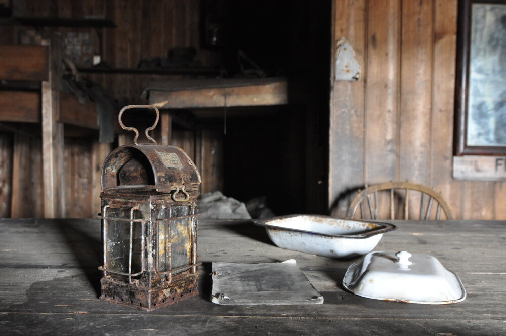 2013-14 Artefacts on the Wardroom table inside Scott's 'Terra Nova' hut