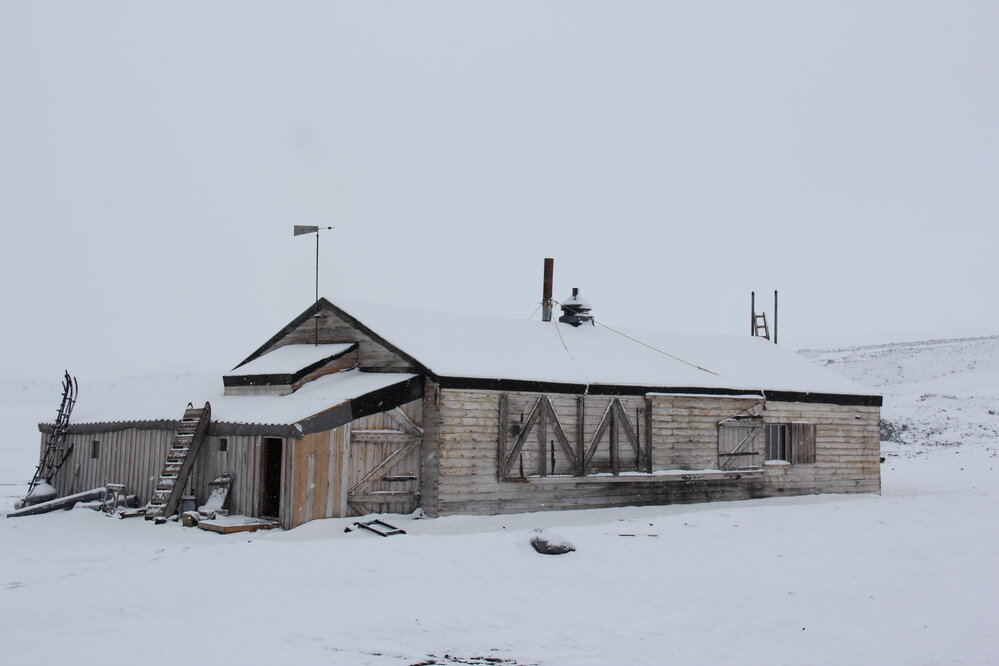2022 Scott's 'Terra Nova' hut, exterior, viewed from South-west during snowfall (001)