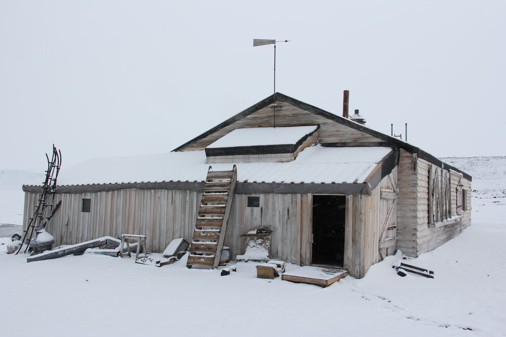 2022 Scott's 'Terra Nova' hut, exterior, viewed from South-west during snowfall (002)