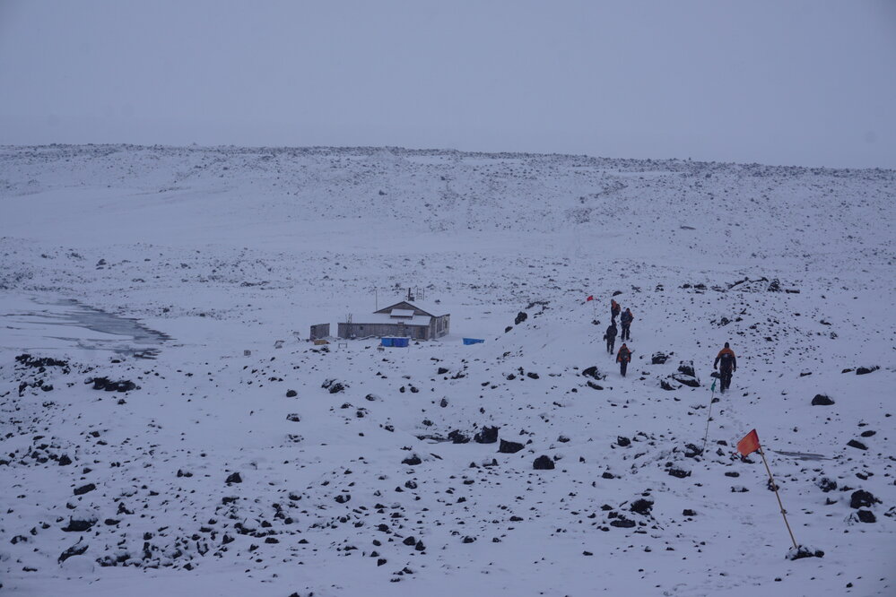 2022 Scott's 'Terra Nova' hut, environs, and AHT staff during snowfall (002)