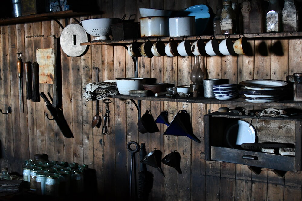 2022 Scott's 'Terra Nova' hut, interior, cooking equipment stored on Galley wall