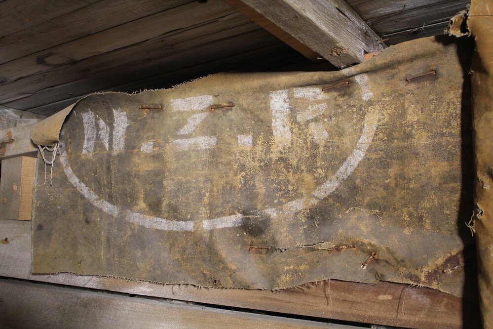 2022 Cape Evans, new artefact finds, NZR tarpaulin, Stables area (001)