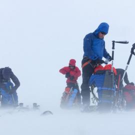 Members of the Antarctic Heritage Trust Inspiring Explorers Expedition™ and their packs in whiteout conditions during their ski crossing of South Georgia