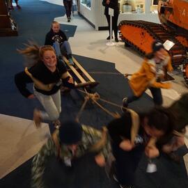 Young Inspiring Explorers pulling a sled at the Canterbury Museum