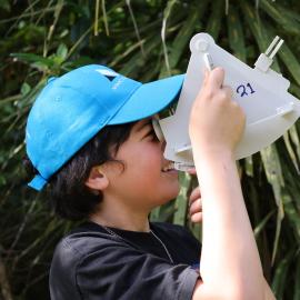 Young Inspiring Explorer Kyren uses a sextant
