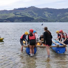 Young Inspiring Explorers carry their rafts to the water (006)