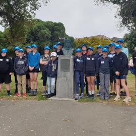 Young Inspiring Explorers with a bust of Frank Worsley in Akaroa