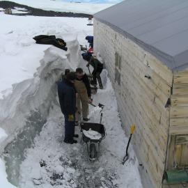 2005 Snow removal from the South wall, Scott's 'Terra Nova' hut, Cape Evans