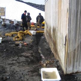 2005 Members of the AHT conservation team inspect the South wall after excavation