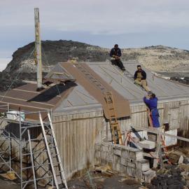 2006 AHT K441 team working on roof repairs at Shackleton's 'Nimrod' hut, Cape Royds