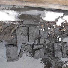 2009-10 Coal briquettes during excavation, Scott's 'Terra Nova' hut