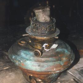 2002 K440B at Scott's 'Terra Nova' hut, interior - Kerosene lamp, Wardroom table