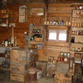 2002 K440B to Shackleton's 'Nimrod' hut, interior - Stores on South wall (001)