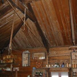 2002 K440B to Shackleton's 'Nimrod' hut, interior - Stores on South wall (002)