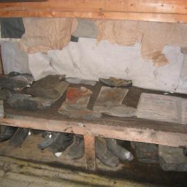 2003-04 Bunk and footwear along south wall in Shackleton's 'Nimrod' Hut (001)
