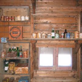 Shelved supplies and window on south wall of Shackleton's 'Nimrod' Hut