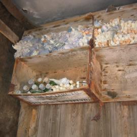 2003-04 Candles stored on Venesta box shelves in darkroom in Shackleton's 'Nimrod' Hut (001)