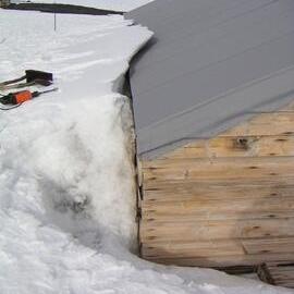 Snow build up on south wall of Scott's 'Terra Nova' Hut