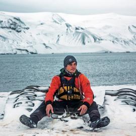 Alexander Hillary with a half buried Massey Ferguson tractor on Deception Island