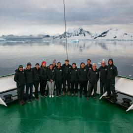 2019 Antarctic Peninsula Expedition team group shot on bow of 'Navigator' 