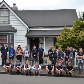 Group photo outside the home where Frank Worsley was born