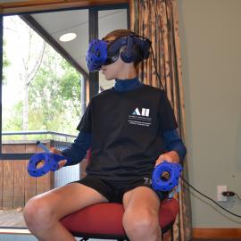 Trying out the Virtual Reality experience of Hillary's Hut (010)