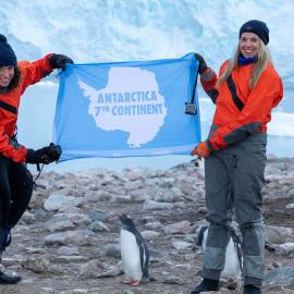 Inspiring Explorers Laurette Siemonek and Anzac Gallate hold up an Antarctic banner