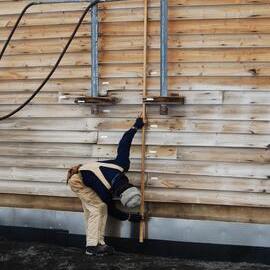 Heritage Carpenter Charley Brentnall measuring east wall