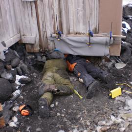 2009-10 AHT's Lucy Skinner and Al Fastier working underneath Shackleton's 'Nimrod' hut