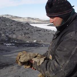2007 Robert Clendon with a found artefact, Cape Royds