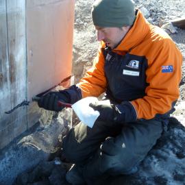 2010-11 Jaime Ward applying mastic during dam installation, Cape Royds