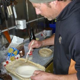 2010-11 Jaime Ward making a pie at field camp