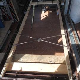 Cape Evans bed frame during repair (001)