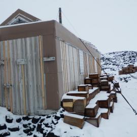 Snow build-up on boxes, Shackleton's 'Nimrod' Hut
