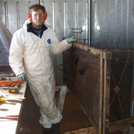 John Evans working on bed frames