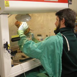 2013-14 Josiah Wagener emptying cans underneath a fume hood (003)