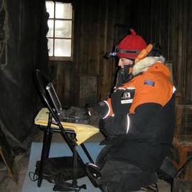 2013-14 Lizzie Meek working inside Scott's 'Discovery' hut, Hut Point