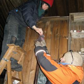 2013-14 Lizzie Meek and Nicola Dunn removing coupons from above Scott's Cubicle