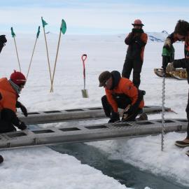 2013-14 Preparing a route over a crack in the sea-ice for the Hägglunds (001)