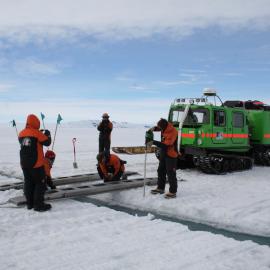 2013-14 Preparing a route over a crack in the sea-ice for the Hägglunds (002)